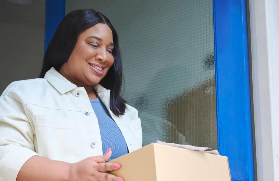 Smiling woman, symbolizing weight loss success.